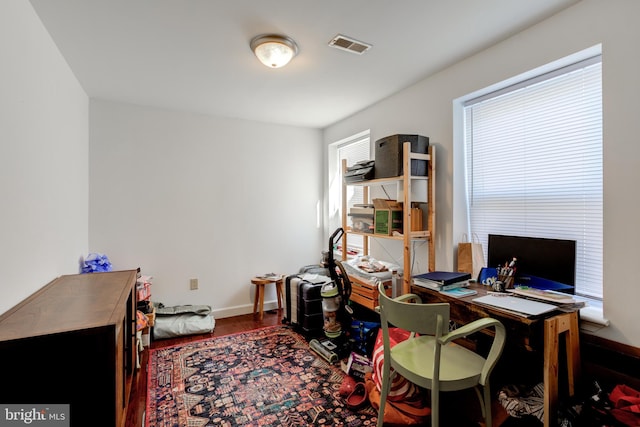 home office with hardwood / wood-style flooring