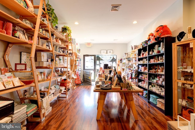 miscellaneous room featuring dark hardwood / wood-style floors