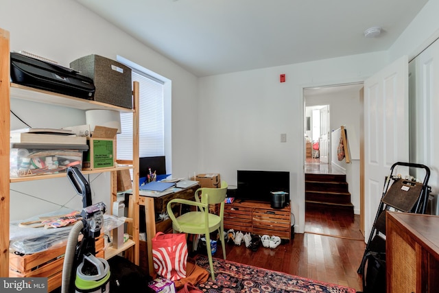 home office with dark wood-type flooring