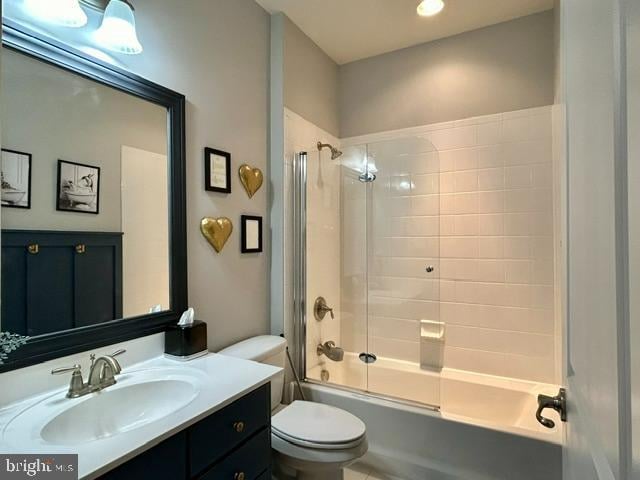 full bathroom featuring vanity, toilet, and enclosed tub / shower combo