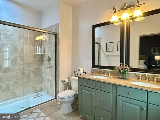 bathroom with vanity, toilet, and an enclosed shower