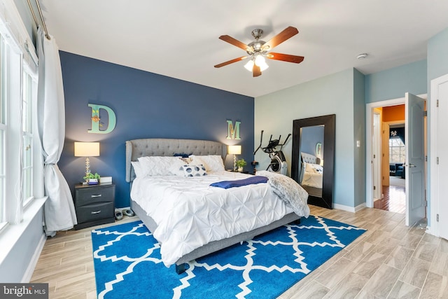 bedroom featuring ceiling fan and light hardwood / wood-style flooring