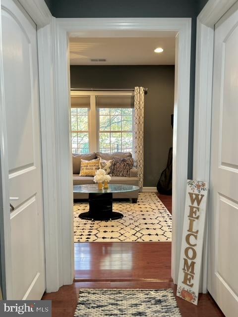 sitting room with dark hardwood / wood-style flooring