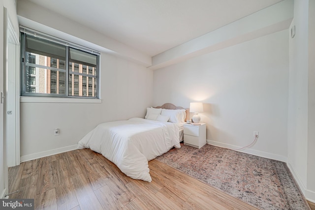 bedroom featuring hardwood / wood-style floors