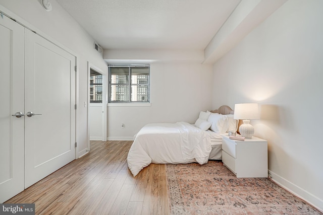 bedroom with light wood-type flooring