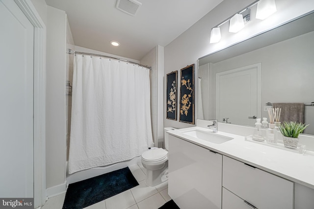 bathroom with vanity, a shower with shower curtain, toilet, and tile patterned flooring