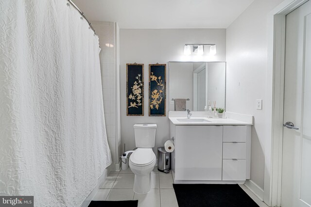 bathroom featuring vanity, a shower with shower curtain, toilet, and tile patterned flooring