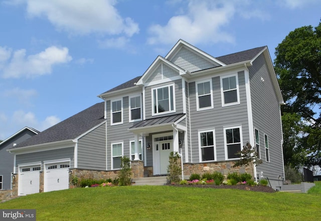 craftsman-style home with a garage and a front lawn