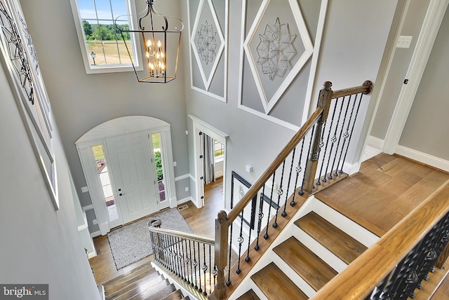 12412 Lusbys Ln, Brandywine, MD 20613 - foyer featuring a wealth of natural light, a notable chandelier, and wood finished floors