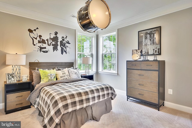 bedroom with ornamental molding and light carpet