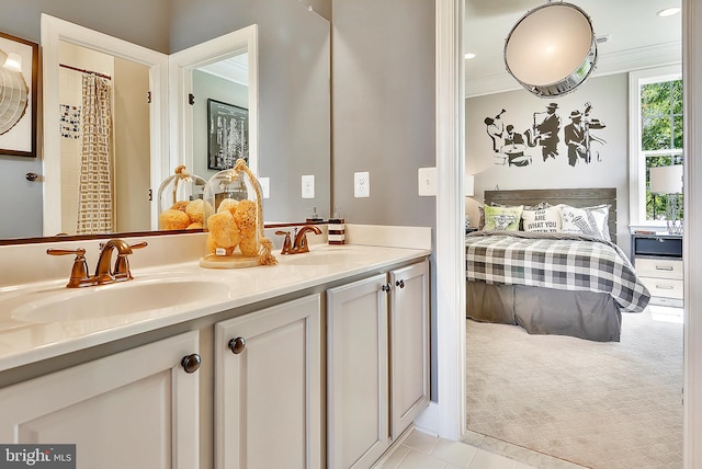 bathroom featuring vanity, crown molding, and tile patterned flooring