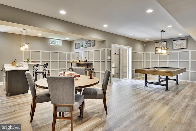 playroom with light hardwood / wood-style floors and billiards