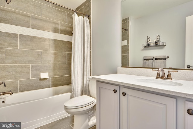 full bathroom with vanity, toilet, tile patterned floors, and shower / tub combo