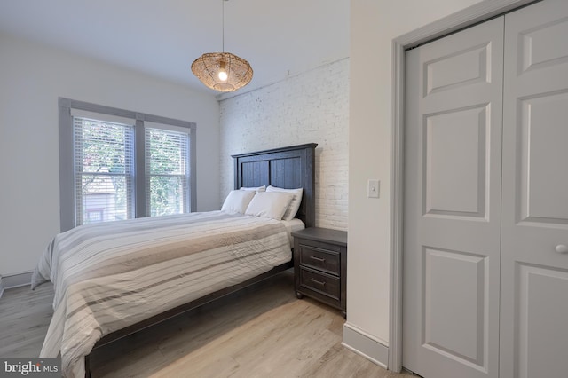 bedroom with a closet and light wood-type flooring