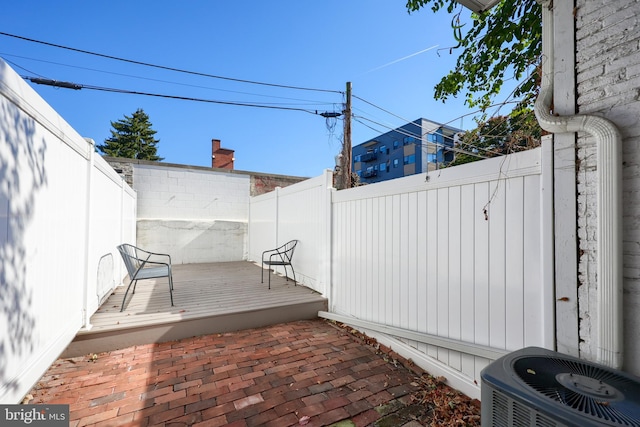 view of patio with central AC