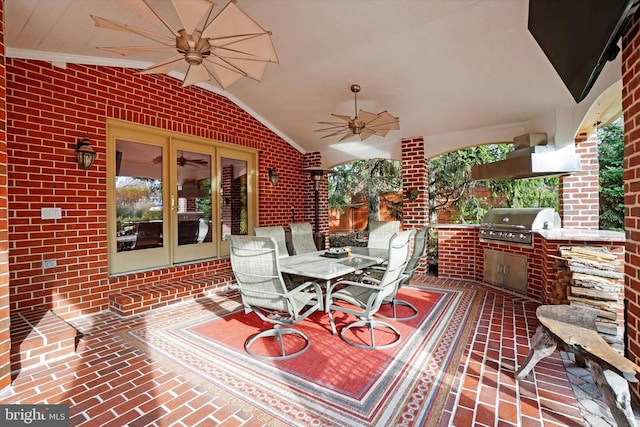 view of patio with area for grilling and ceiling fan