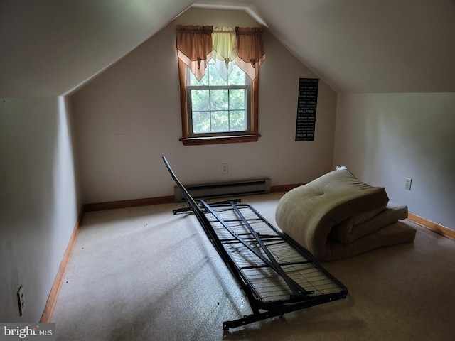 interior space featuring lofted ceiling, a baseboard heating unit, and carpet floors