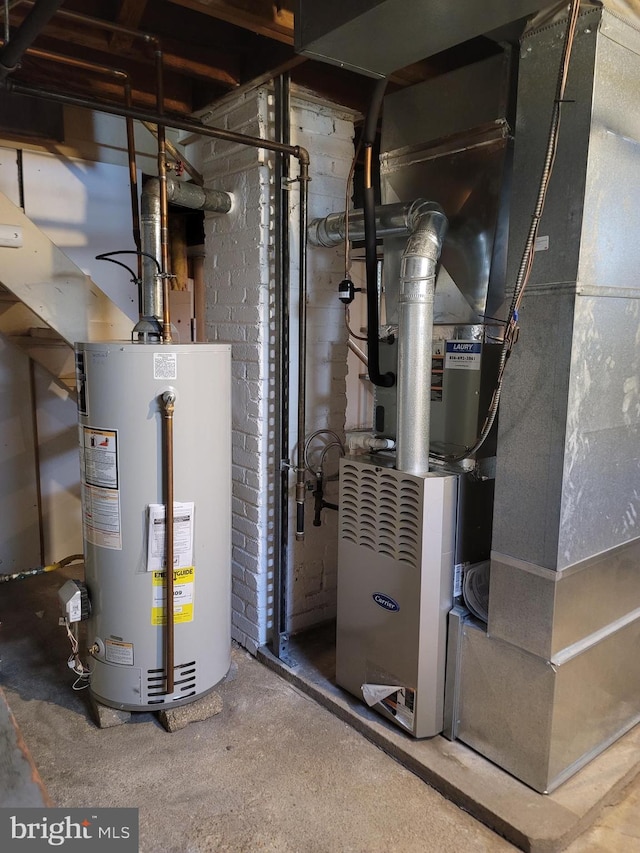 utility room with gas water heater