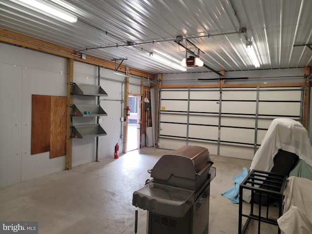 garage featuring a garage door opener