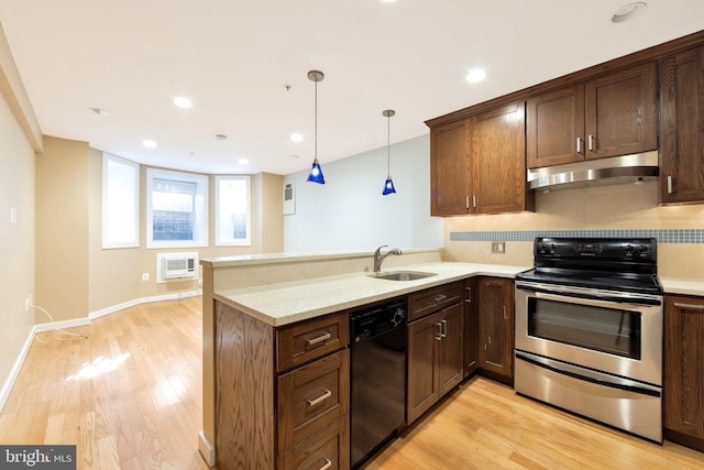 kitchen featuring stainless steel range with electric cooktop, sink, light hardwood / wood-style flooring, black dishwasher, and light stone counters