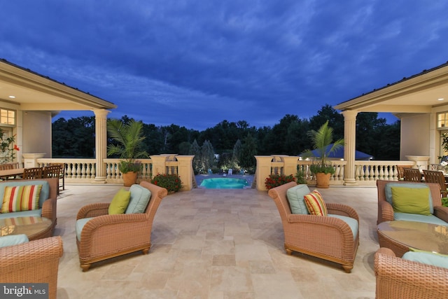 view of patio terrace at dusk