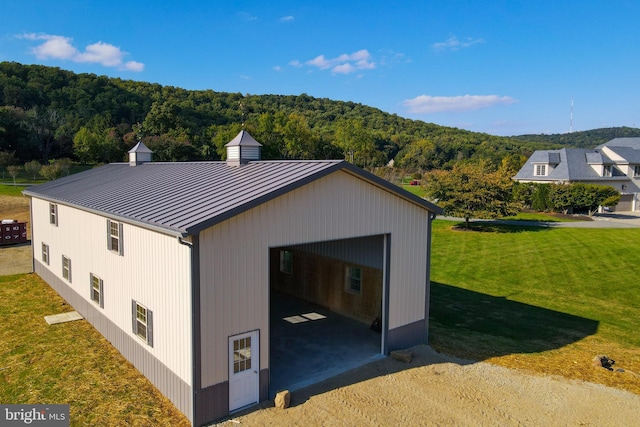 exterior space featuring a garage and a yard