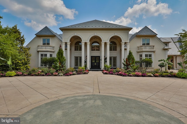 mediterranean / spanish-style home featuring french doors