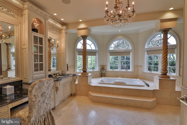 bathroom with vanity, a relaxing tiled tub, tile patterned floors, and crown molding