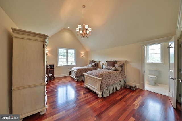 bedroom featuring ensuite bathroom, dark hardwood / wood-style floors, a chandelier, and vaulted ceiling