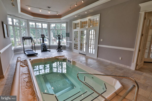 view of swimming pool with an indoor in ground hot tub