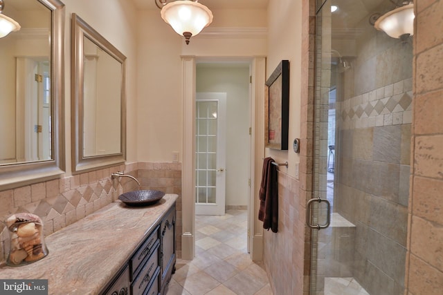 bathroom with vanity and a shower with shower door