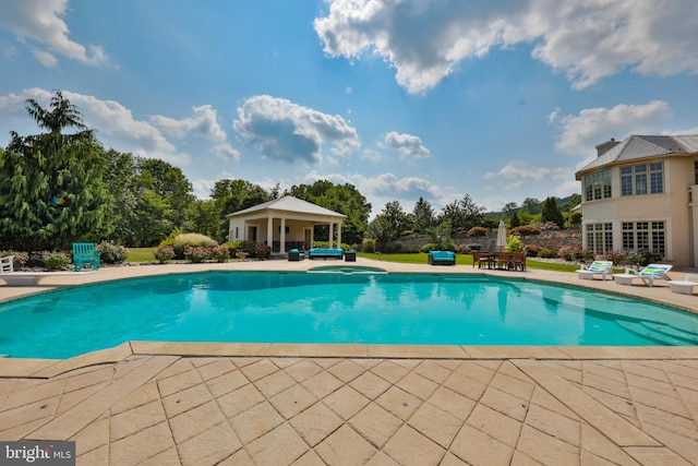 view of swimming pool featuring a patio area