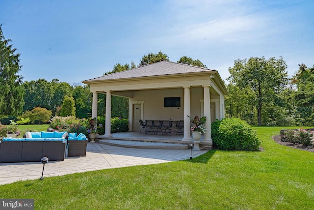 view of patio / terrace featuring exterior bar, a gazebo, and an outdoor living space