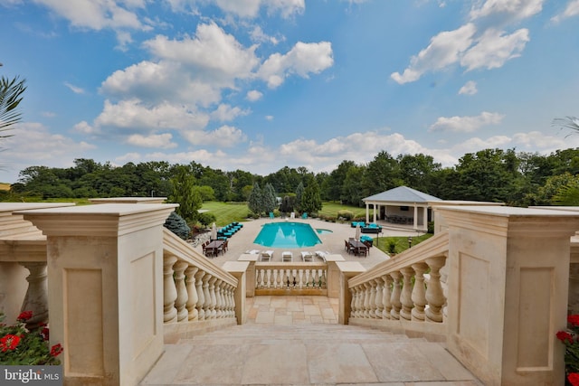 view of pool featuring a patio