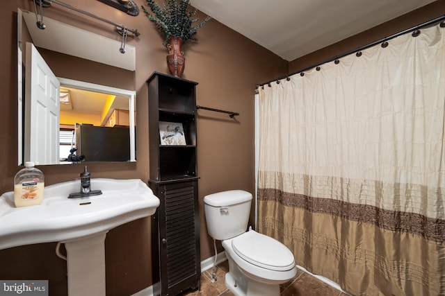 14211 Dukes Ave Unit 203, Ocean City, MD 21842 - bathroom featuring toilet and curtained shower