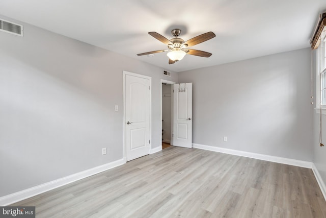 unfurnished bedroom with visible vents and baseboards