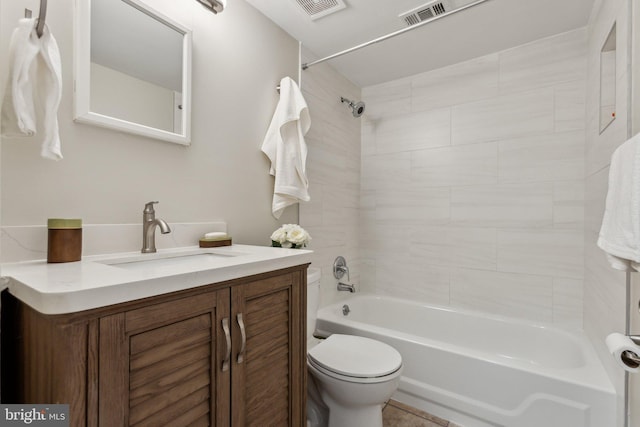 full bathroom with visible vents, vanity, toilet, and  shower combination