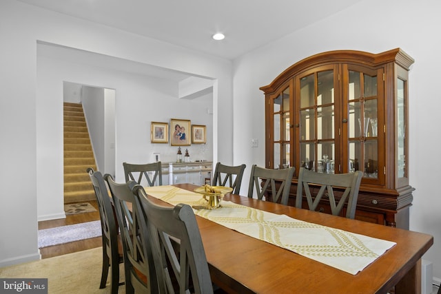 dining area with hardwood / wood-style floors