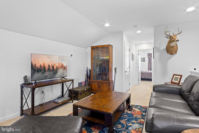 living room with lofted ceiling and light carpet