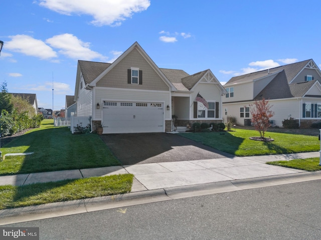 view of front facade featuring a front yard and a garage