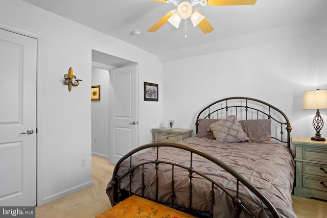 bedroom with ceiling fan and light carpet