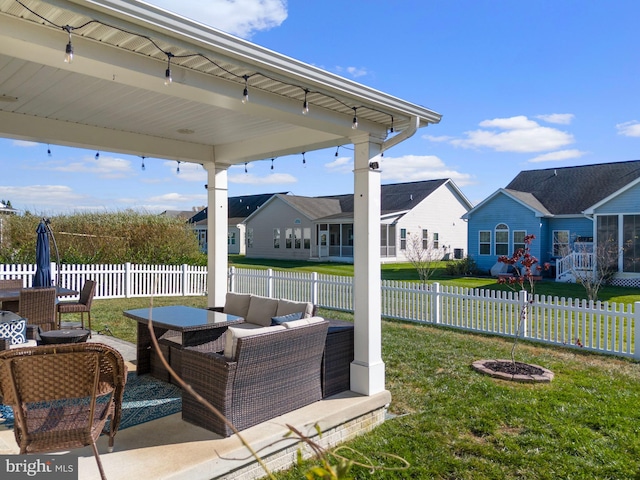 view of patio featuring an outdoor living space with a fire pit