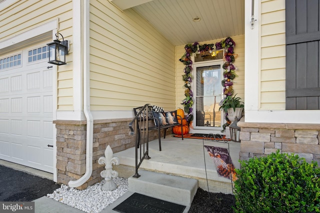 view of exterior entry featuring a garage