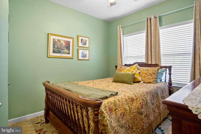 bedroom with light colored carpet and ceiling fan