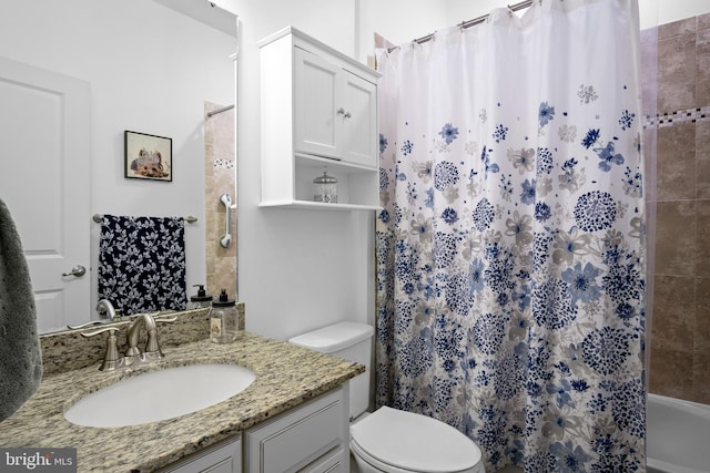 full bathroom featuring toilet, shower / bath combo with shower curtain, and vanity