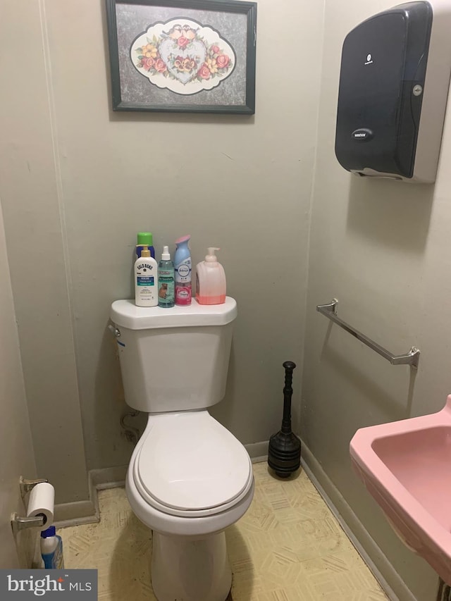 bathroom with toilet and sink