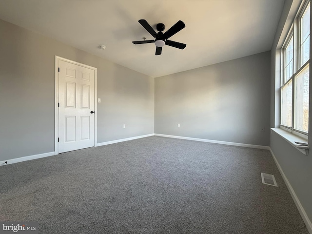 carpeted empty room with ceiling fan