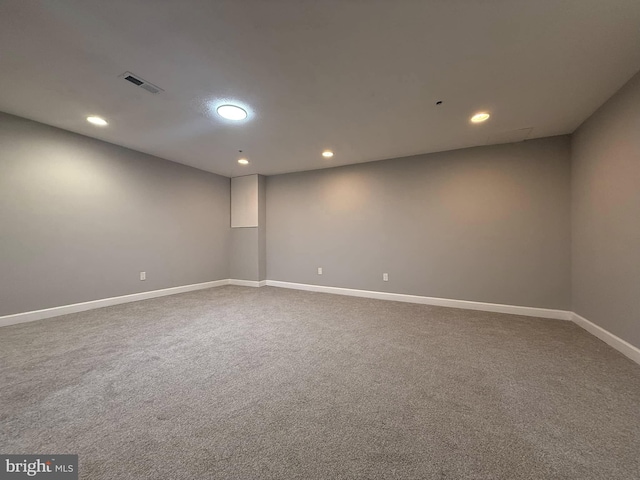 unfurnished room featuring carpet