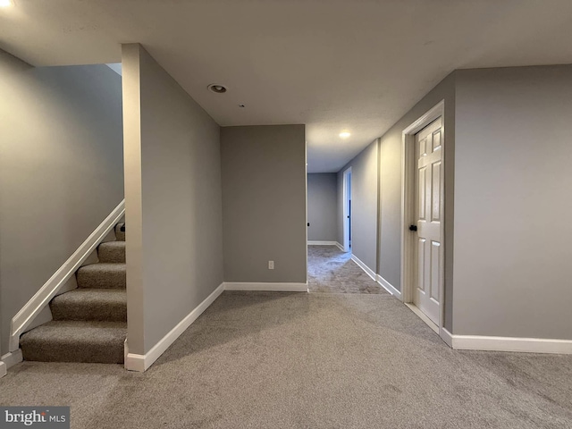 hallway with carpet floors