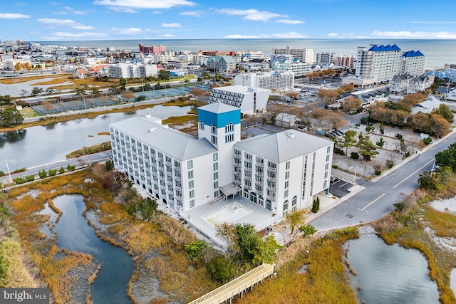 birds eye view of property with a water view